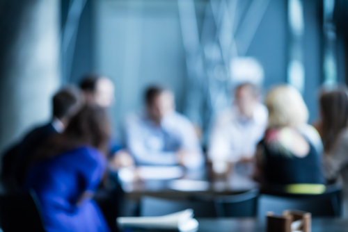 Image of a panel having a meeting